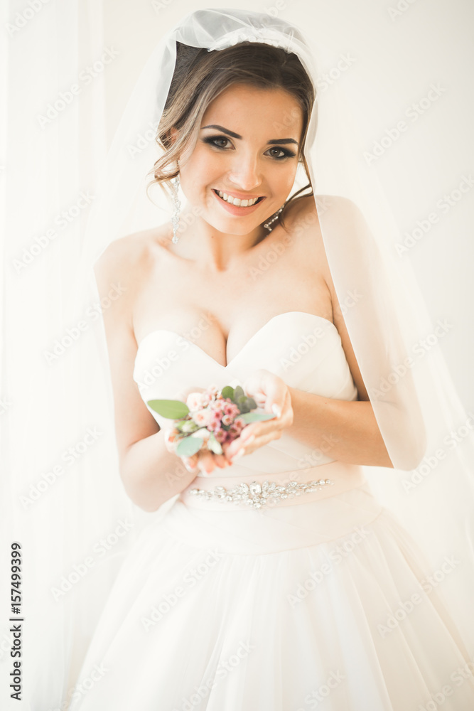 Portrait of beautiful bride with fashion veil at wedding morning. Portrait of beautiful bride with fashion veil at wedding morning.