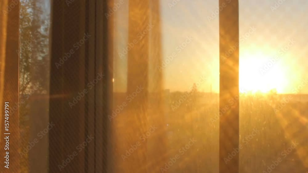 Sunset sunrise view through transparent curtain