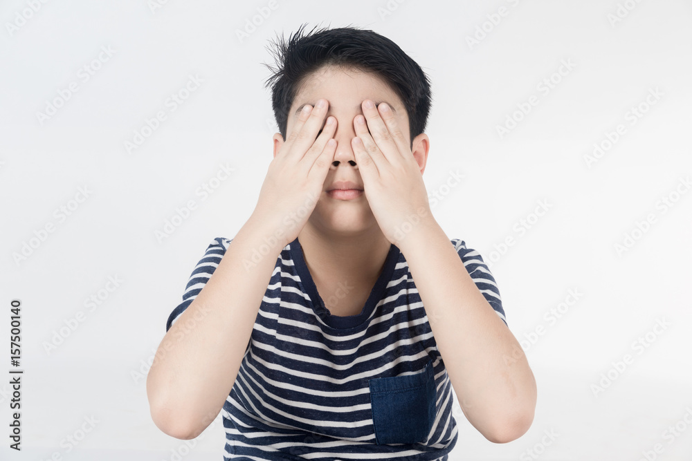Portrait of asian child upset and close your eye by hand . Portrait of asian child upset and close your eye by hand .