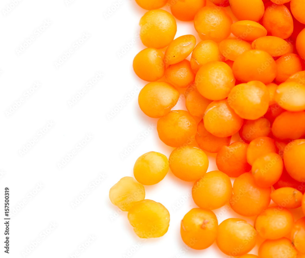 Red lentils on a white background Red lentils on a white background