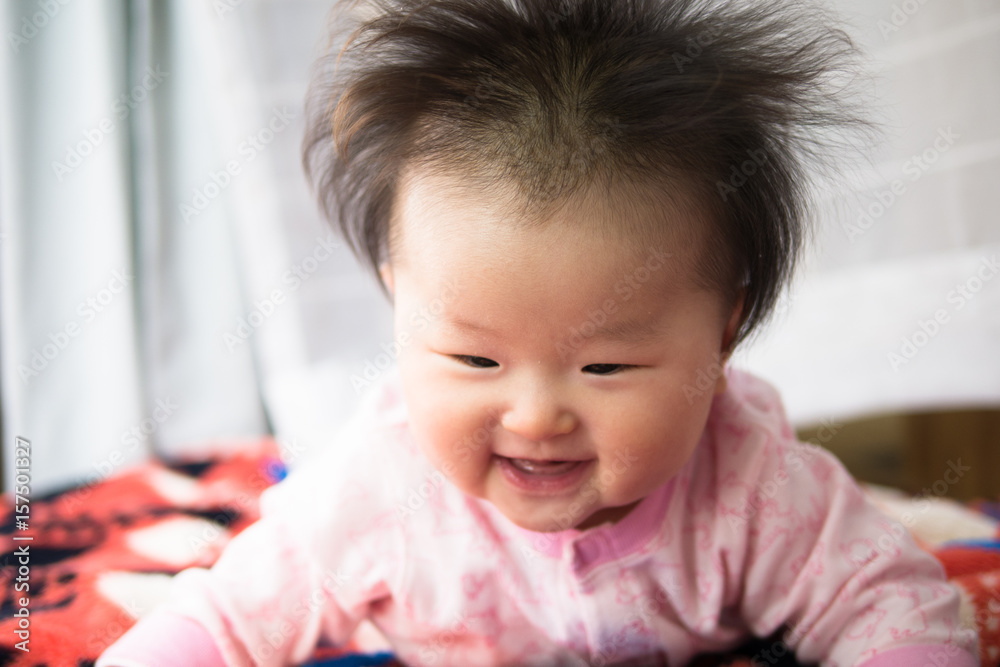 Baby playing at the window side curtain race / Six months after birth Baby playing at the window side curtain race / Six months after birth