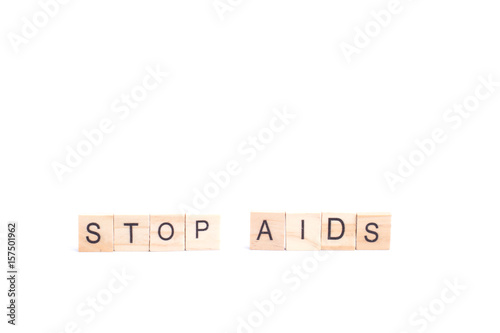 STOP AIDS word on square tile concept isolated on white background