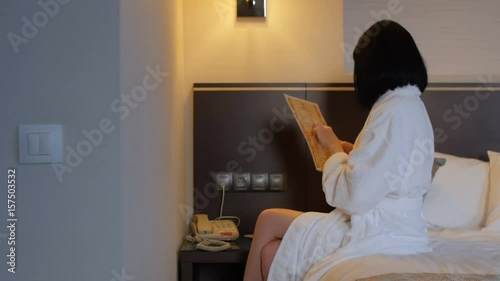 A beautiful woman is calling on the phone at the hotel reception. Journey. Business woman