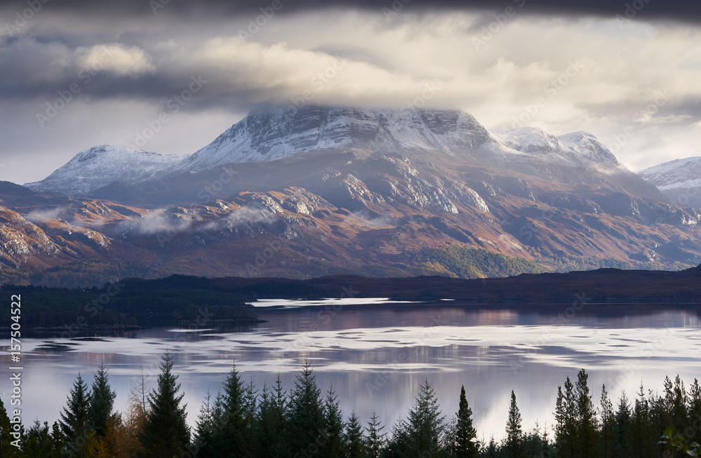 The summits of Slioch and Beinn a Mhuinidh over Loch Maree in the Scottish Highlands, Scotland, UK.