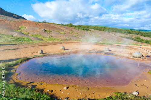 Blue pool at the Haukadalur geothermal area in Iceland photo