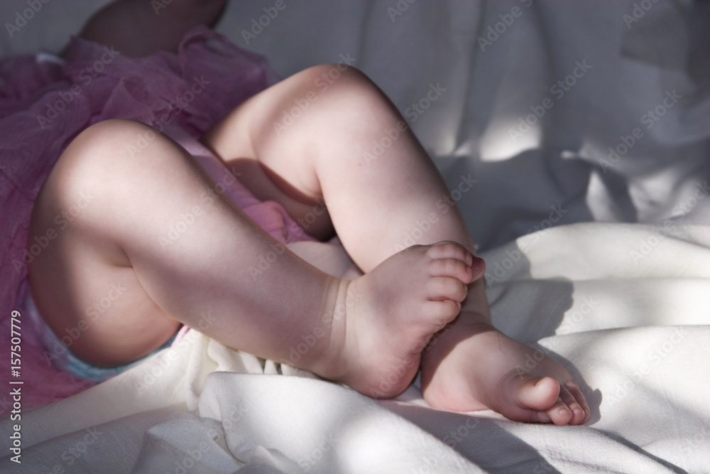 The legs of a small child close-up