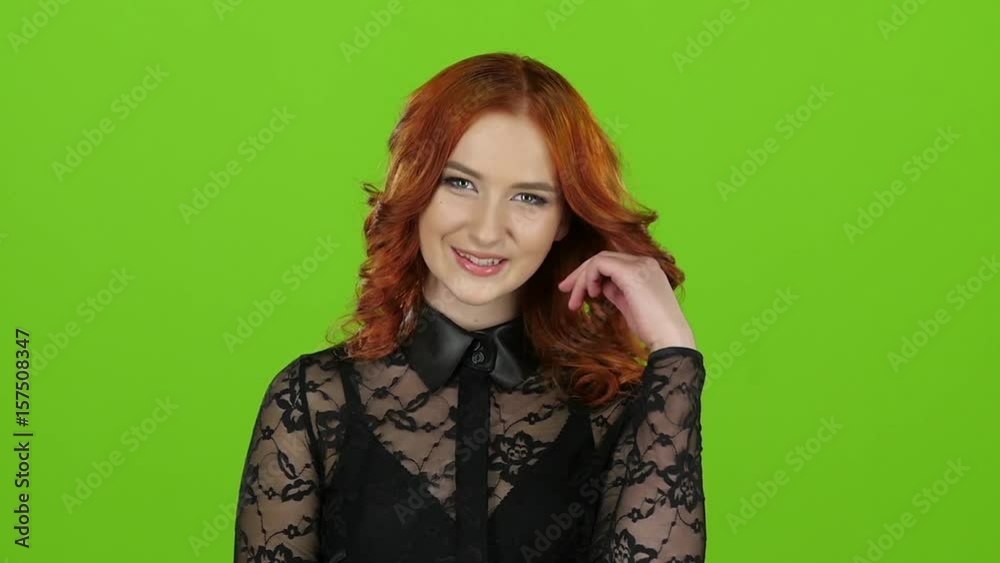 Girl flirts and sends air kisses to everyone around her. Green screen. Slow motion Girl flirts and sends air kisses to everyone around her. Green screen. Slow motion