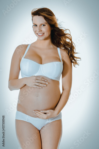 Pregnant woman in underwear.