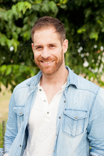 Casual guy with a denim shirt relaxed