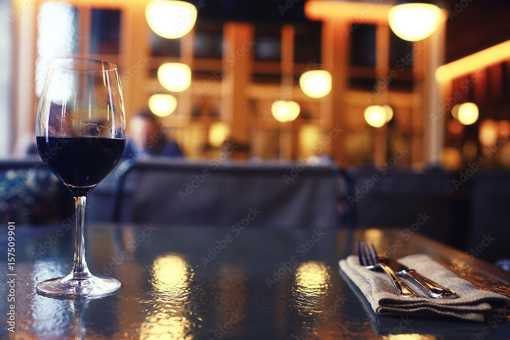 Serving a glass of red wine in a restaurant Serving a glass of red wine in a restaurant
