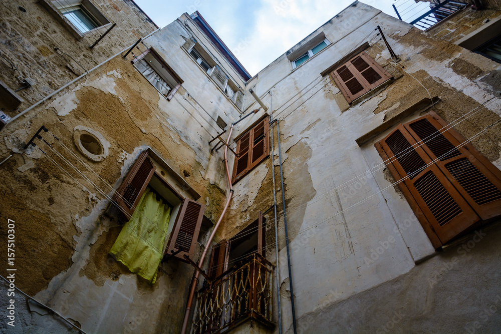 Upward view in alley in Polignano a Mare, Puglia, Italy