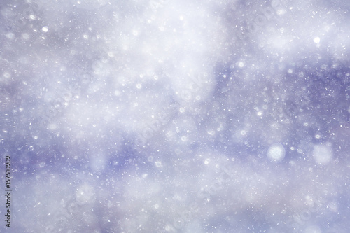 Snowfall texture of snowflakes on blurred background © kichigin19