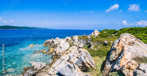 Bizarre granite rocks and amazing azure water on beautiful Sardinia island near Porto Pollo, Sargedna, Italy photo