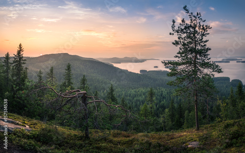 Scenic landscape with lake and sunset at evening in national park Koli, Finland photo