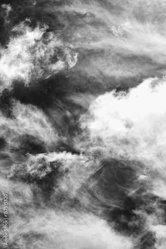 Cloudscape background of black and white dramatic monochrome cirrus and cumulus clouds