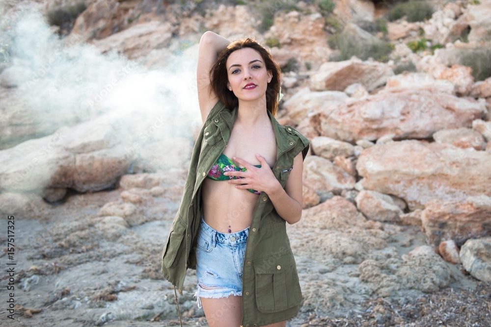 Fototapeta premium Beautiful girl outdoor with with smoke bomb