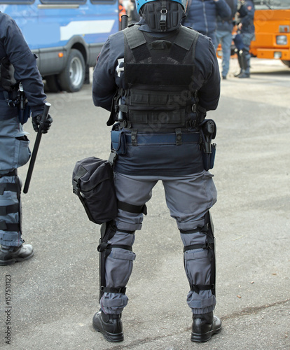 police in riot gear with batons during a protest i