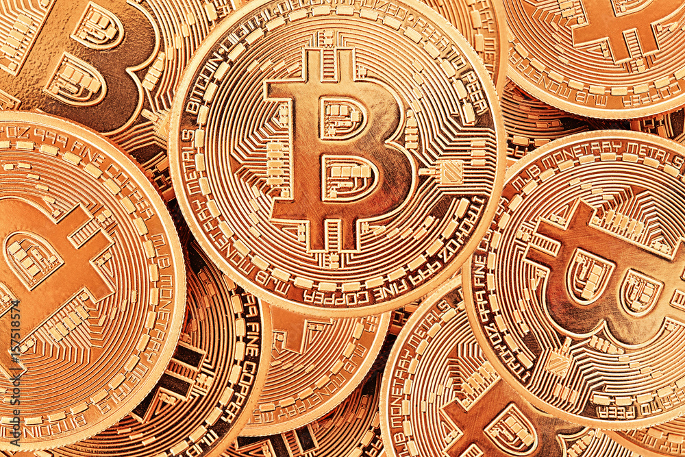 Golden Bitcoins close-up as a background.Photo (new virtual money ) .Conceptual photo. 