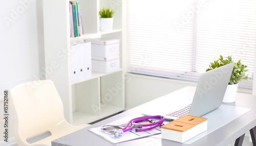 Desk of an artist with lots of stationery objects. Studio shot on wooden background
