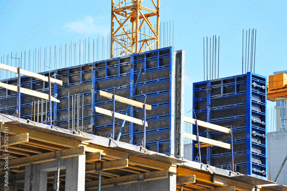 Crane and highrise construction site