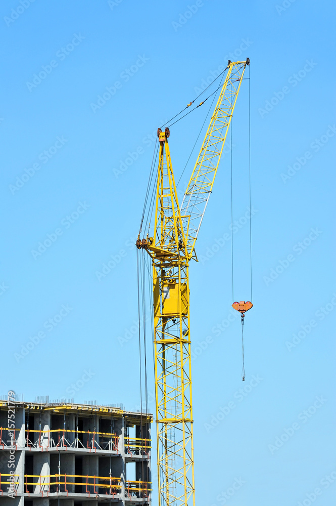 Crane and highrise construction site Crane and highrise construction site