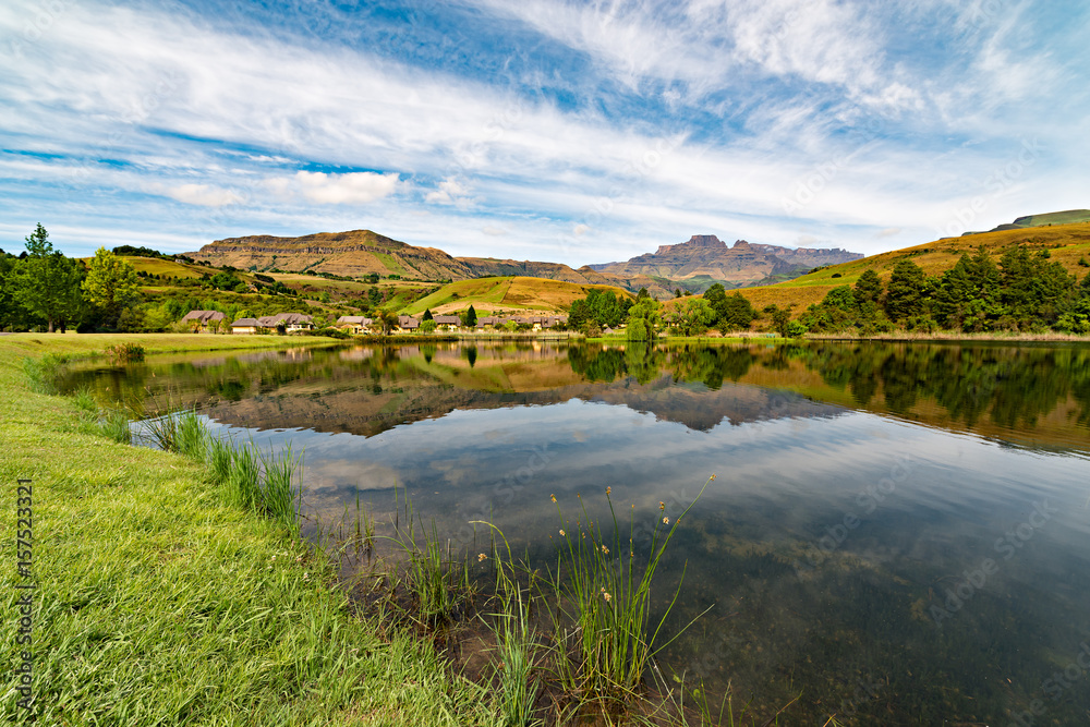 View over dam of Cathkin Peak in the Drakensberg mountains near Champagne Castle