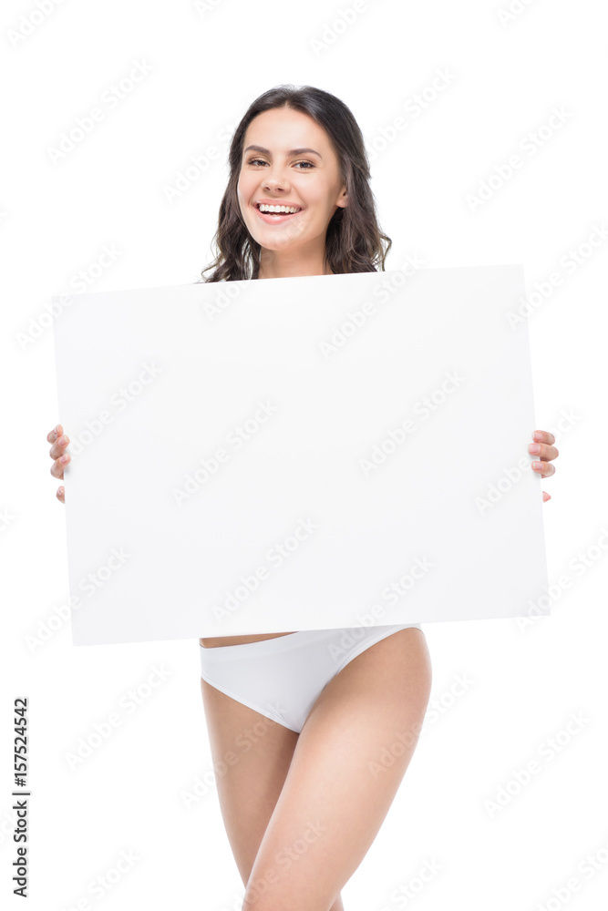 Smiling young woman in underwear holding blank banner and looking at camera Smiling young woman in underwear holding blank banner and looking at camera