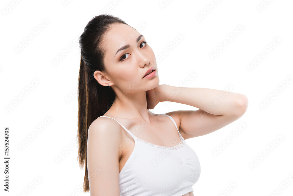 portrait of tender asian girl posing while looking at camera isolated on white portrait of tender asian girl posing while looking at camera isolated on white