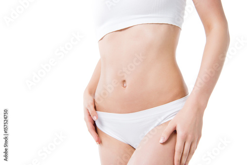cropped view of slim woman's waist isolated on white © LIGHTFIELD STUDIOS