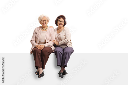 Two elderly women sitting on a panel © Ljupco Smokovski