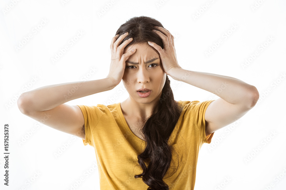 shocked asian girl with hands on head isolated on white shocked asian girl with hands on head isolated on white