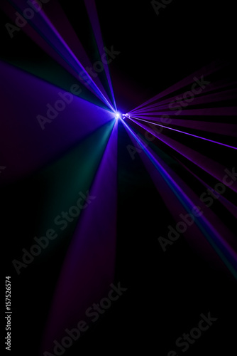 Laser beam purple on a black background