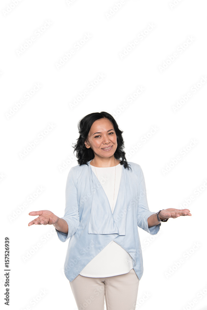 smiling casual asian woman standing with open hands isolated on white smiling casual asian woman standing with open hands isolated on white