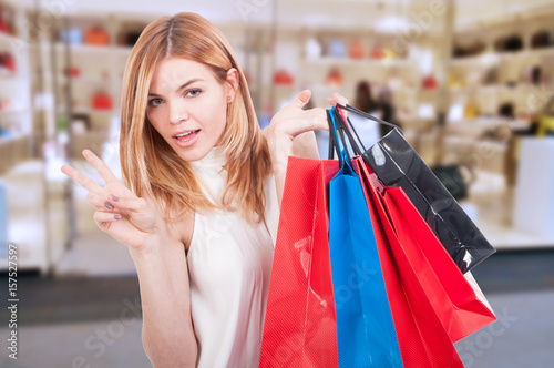 Stylish smiling girl with shopping bags