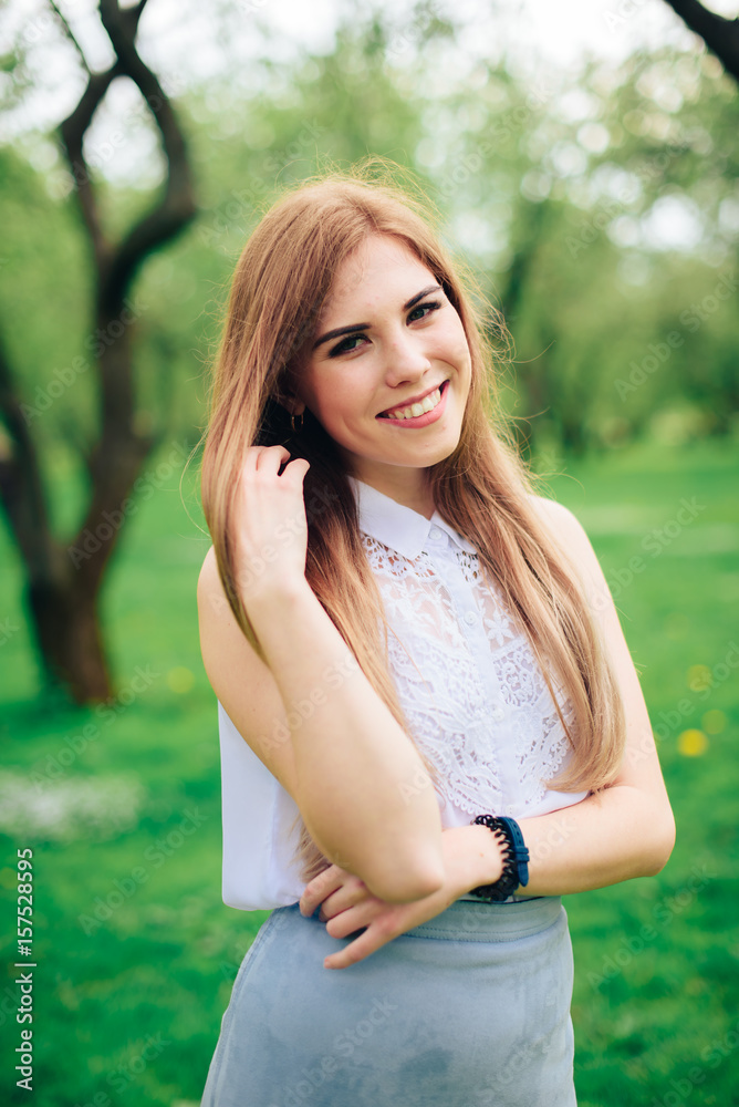 Beautiful woman in a summer park in sunny weather Beautiful woman in a summer park in sunny weather