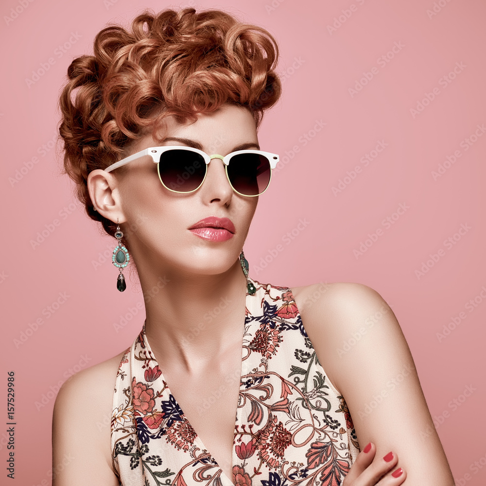 Fashion Portrait Model in Sexy Dress. Stylish Mohawk hairstyle,fashion Makeup.Beauty woman in Trendy Sunglasses,Glamour Redhead,fashion pose.Playful Girl,Luxury summer Accessories.Summer Floral Outfit Fashion Portrait Model in Sexy Dress. Stylish Mohawk hairstyle,fashion Makeup.Beauty woman in Trendy Sunglasses,Glamour Redhead,fashion pose.Playful Girl,Luxury summer Accessories.Summer Floral Outfit