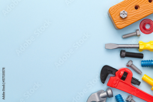 Fototapeta Naklejka Na Ścianę i Meble -  Toys Tools on Blue Background
