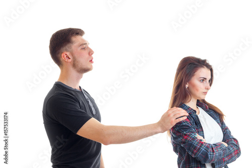 young guy put his hand on the shoulder of the girl