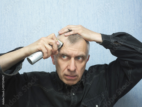 Man Trimming His Hair photo