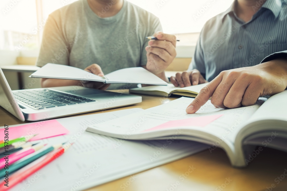 Young students campus helps friend catching up and learning tutoring. People, learning, education and school concept Young students campus helps friend catching up and learning tutoring. People, learning, education and school concept