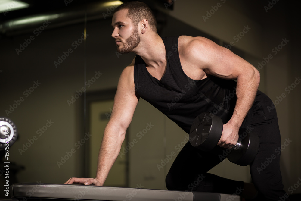 Sporty sexy men with great abdominal muscles in black sportswear Sporty sexy men with great abdominal muscles in black sportswear