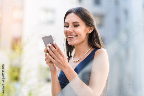 Free Download Happy woman sending sms by phone - GFXLoad
