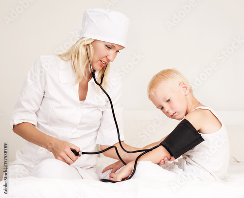 doctor examining  blood pressure photo