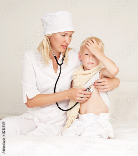 doctor examining a child photo