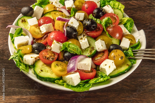 Greek salad with feta, fresh vegetables, and copyspace