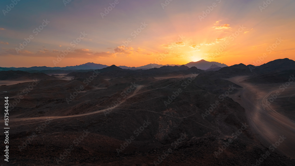 Egypt desert with mountains at sunset