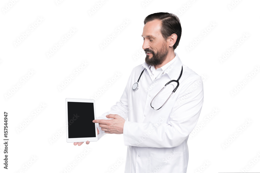 bearded doctor in white coat with stethoscope presenting digital tablet with blank screen isolated on white bearded doctor in white coat with stethoscope presenting digital tablet with blank screen isolated on white