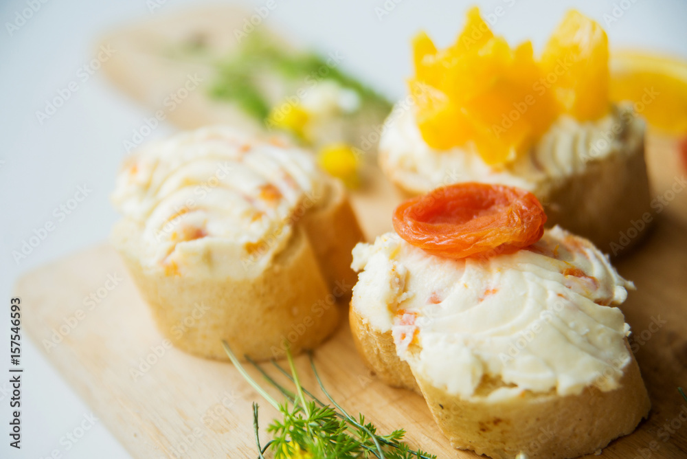 Many kinds of sandwiches, bruschetta, and tea, coffee, fresh juice - for a family breakfast. The top view Many kinds of sandwiches, bruschetta, and tea, coffee, fresh juice - for a family breakfast. The top view