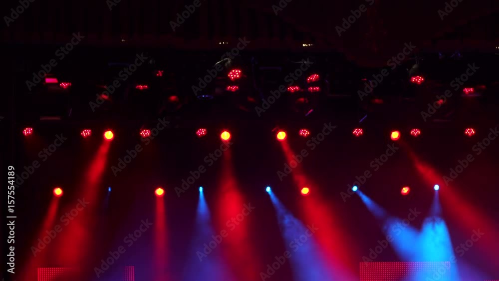 Red stage lights, light show at the concert. Light show testing before the concert.
