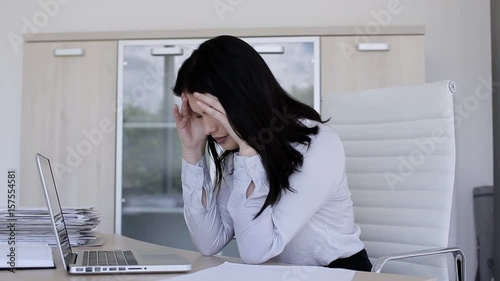 Woman have back pain after sitting all day in office